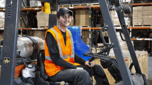 Forklift driver at warehouse.